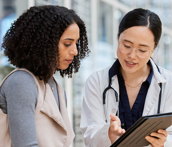 Doctor, woman patient and tablet for consulting with results, medical info and talk for healthcare with mockup space. Japanese medic, digital touchscreen or show video for surgery, wellness or advice.